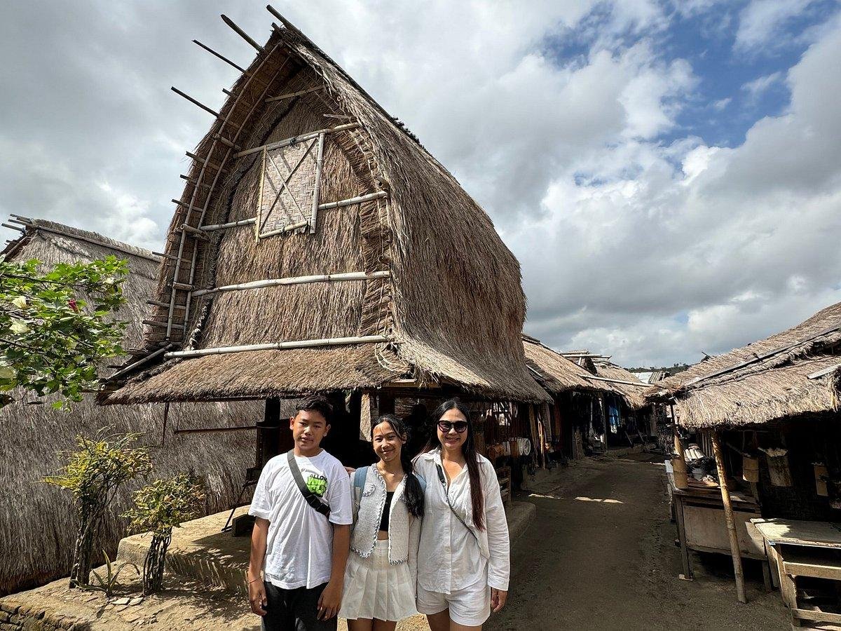 Travelers exploring a traditional Sasak village in Lombok