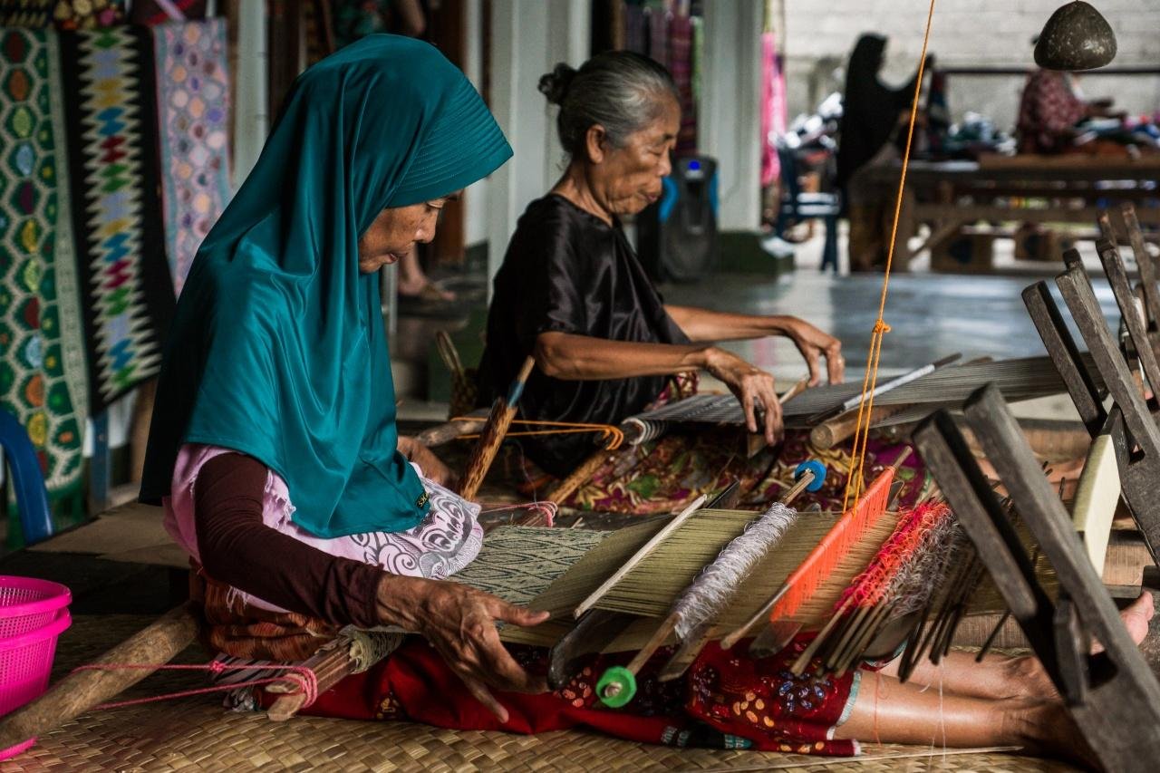 Traditional Sasak women weaving handmade textiles in Lombok